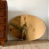 Vintage smoked oval wall mirror
