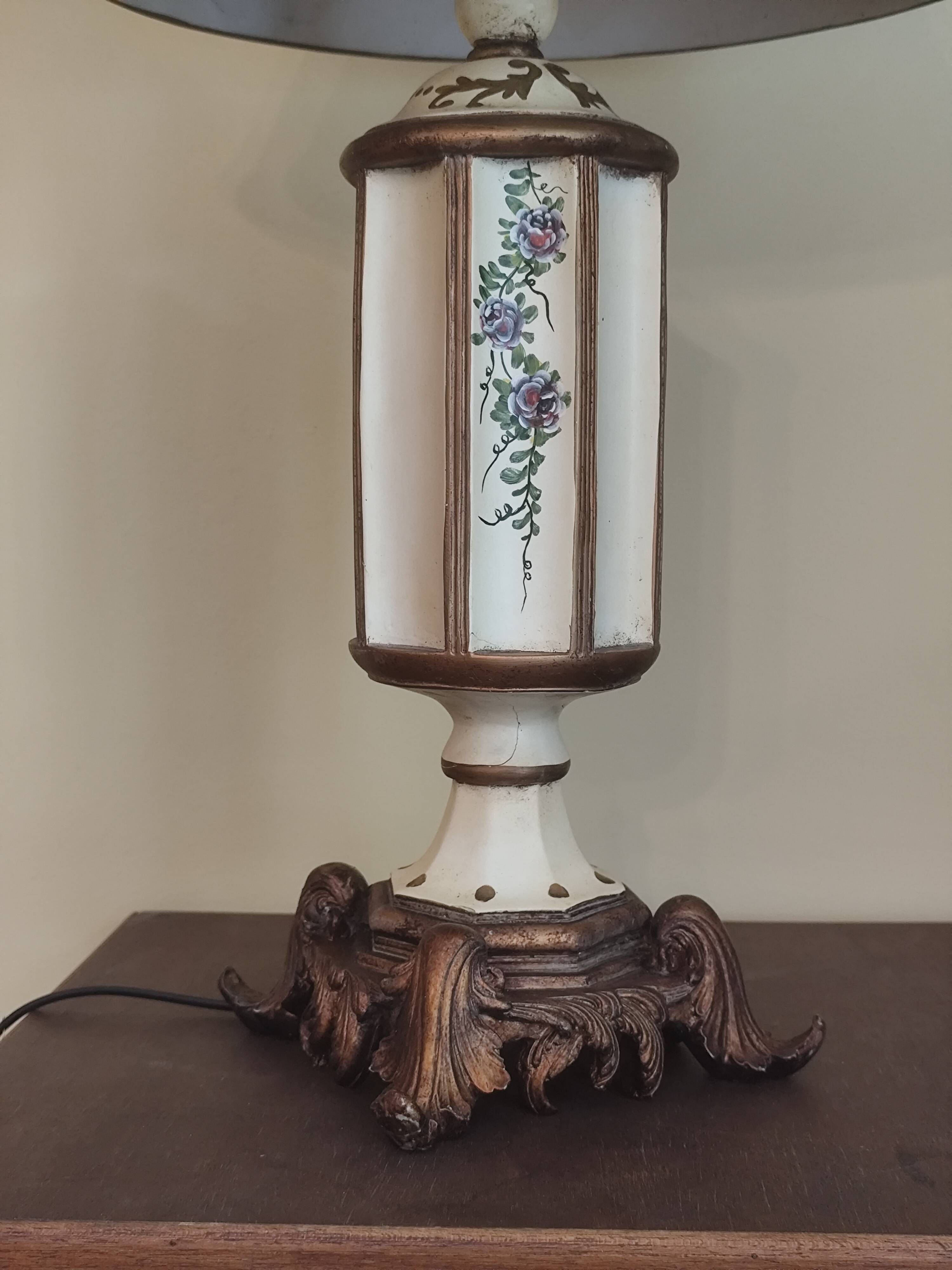 Large pagoda lamp painted with floral patterns and metal shade.