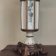 Large pagoda lamp painted with floral patterns and metal shade.