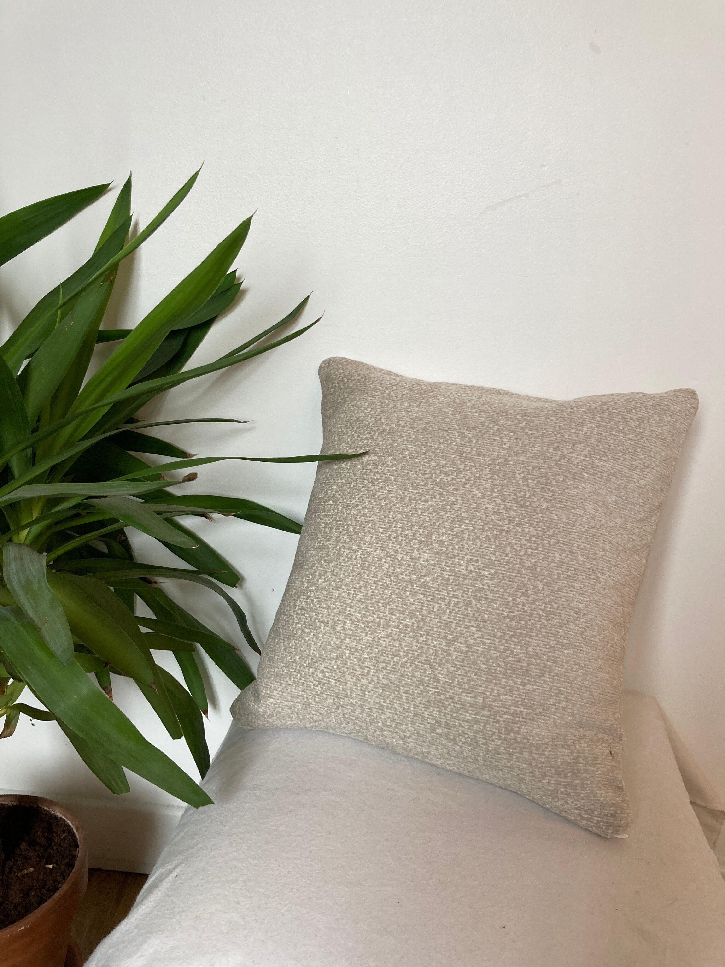 Off-white beige velvety effect cushion