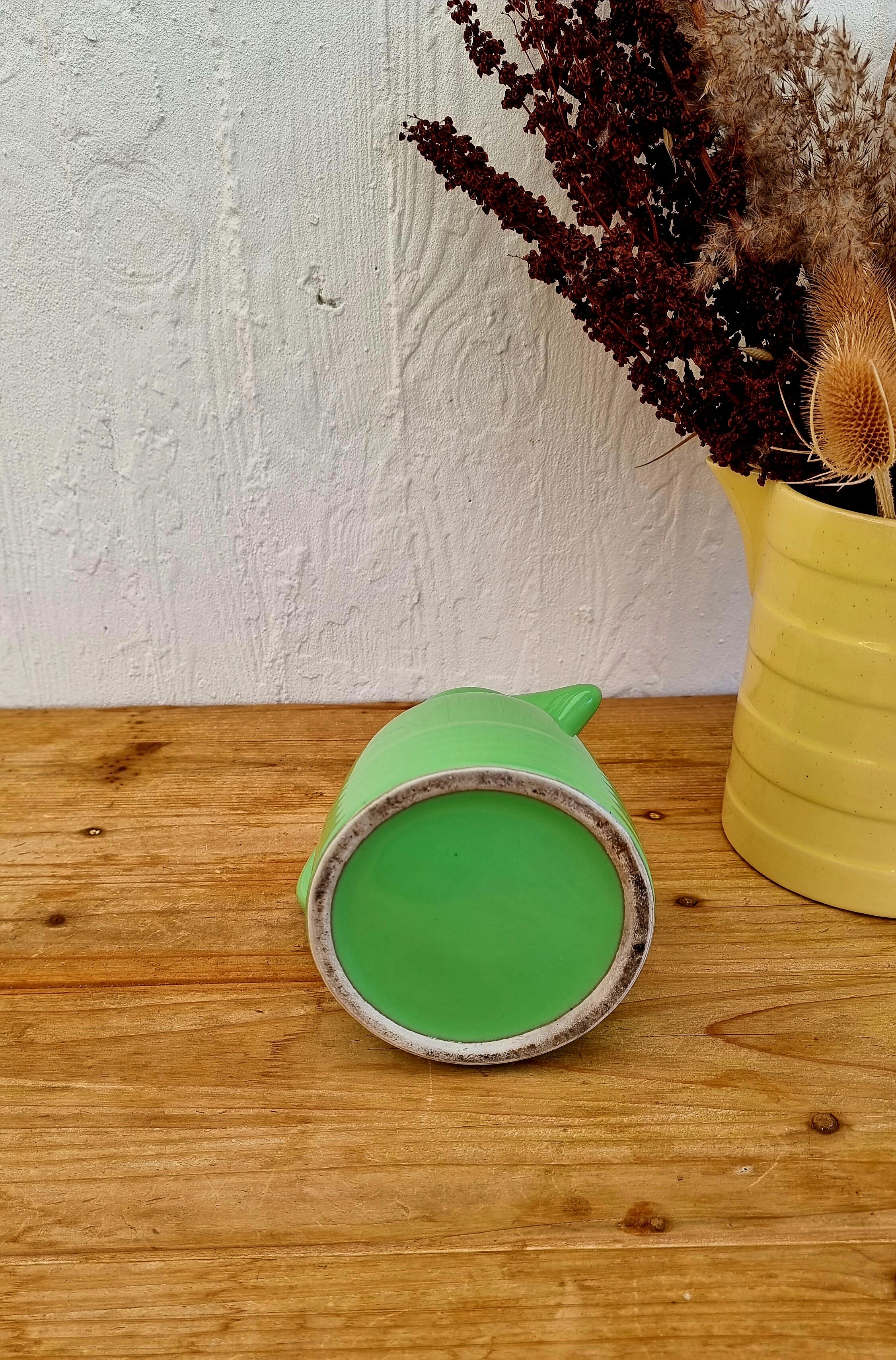 Vintage green earthenware pitcher