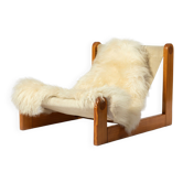 Brutalist sling lounge chair in canvas, pine and sheepskin, Belgium, 1970s