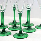 8 large green stem champagne flutes in very good condition.