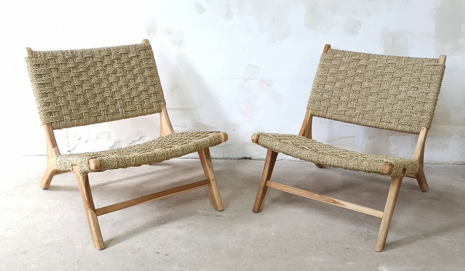 Pair of low armchairs in wood and woven rattan