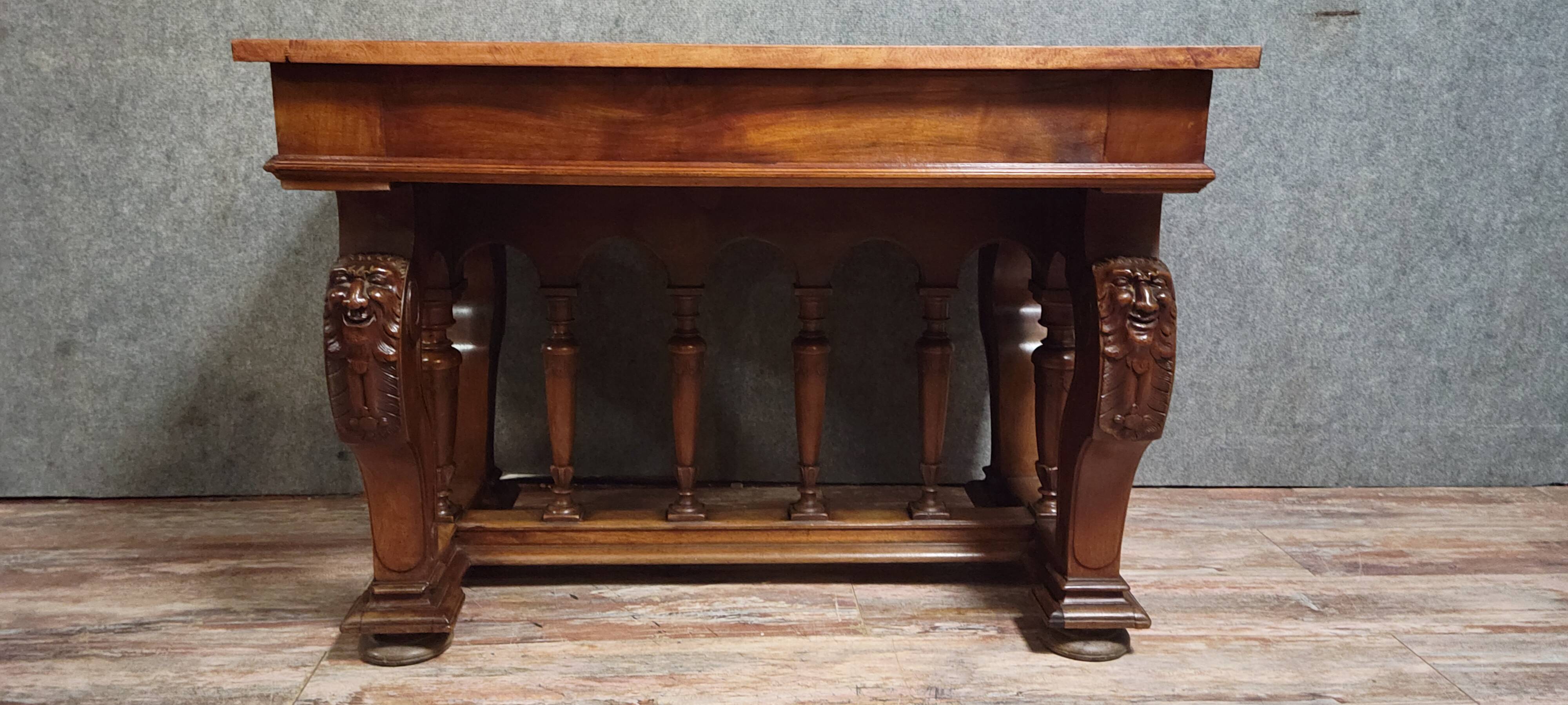 Antique desk in Renaissance style made of walnut from the late 19th century.