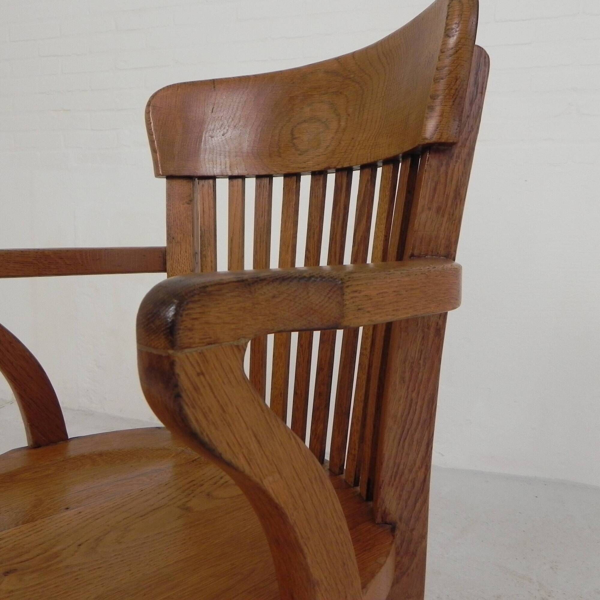 Oak office chair with adjustable spring system and height adjustment, 1950s.