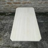 Low table in travertine and aluminium
