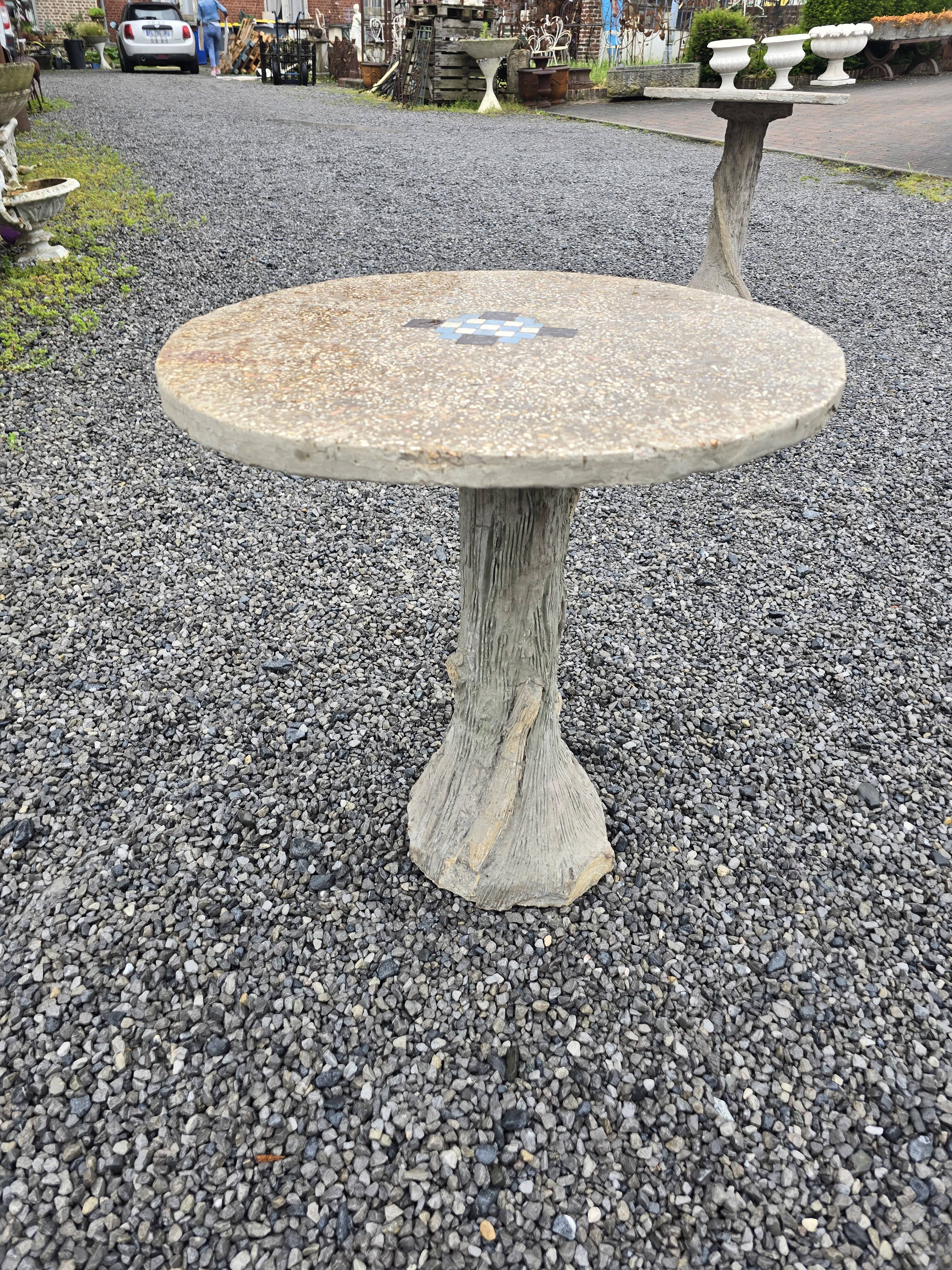 Cement garden table with trunk-shaped foot