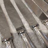 12 silver-plated table knives, Christofle goldsmith ribbons