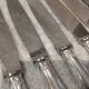12 silver-plated table knives, Christofle goldsmith ribbons