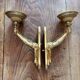 Paire d’appliques murales bronze bras tendus mains