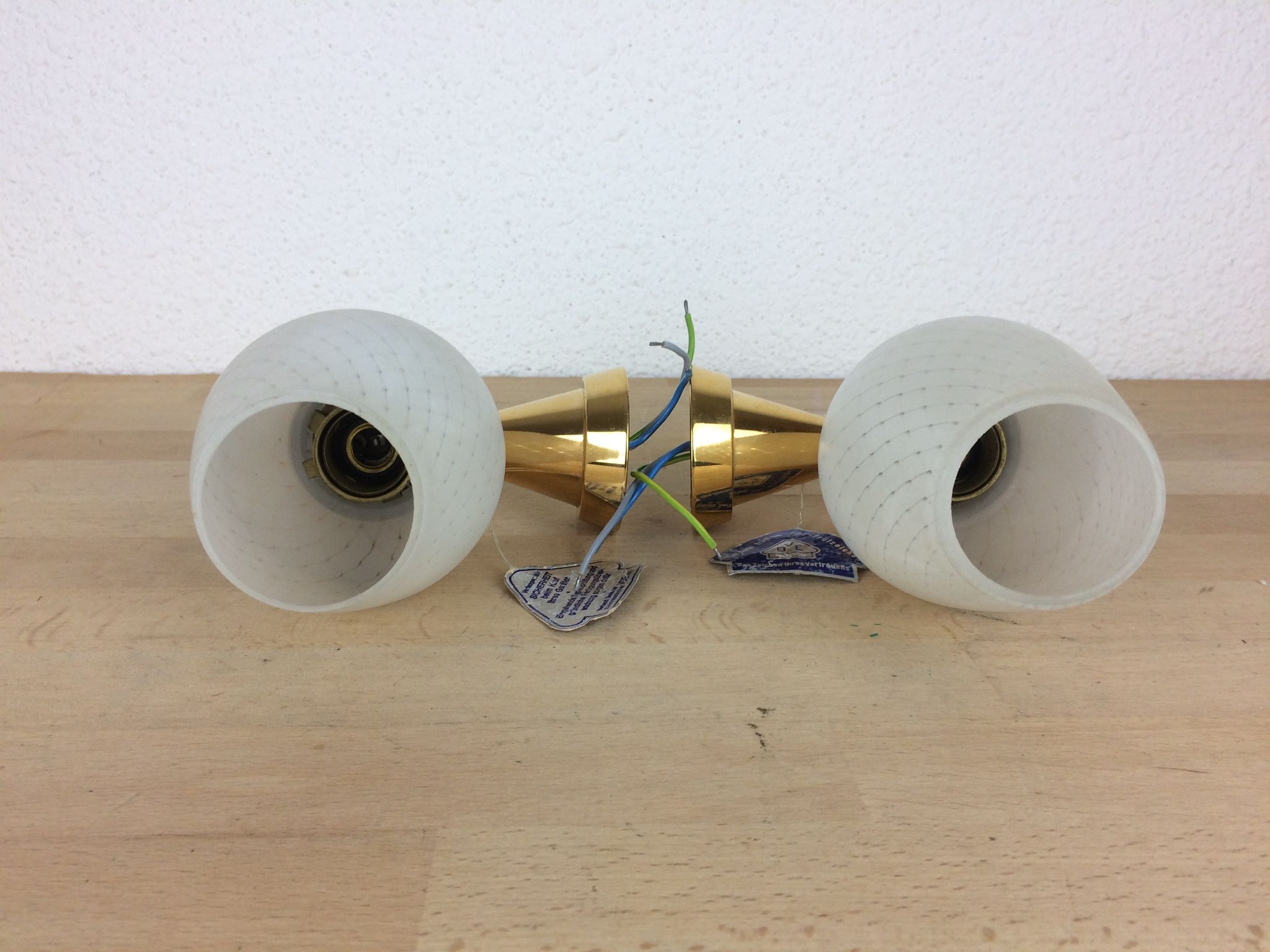 Pair of solid brass and white opaline wall lamps