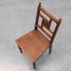 Art Deco oak side chair with carved rosette back and turned front legs, Bel