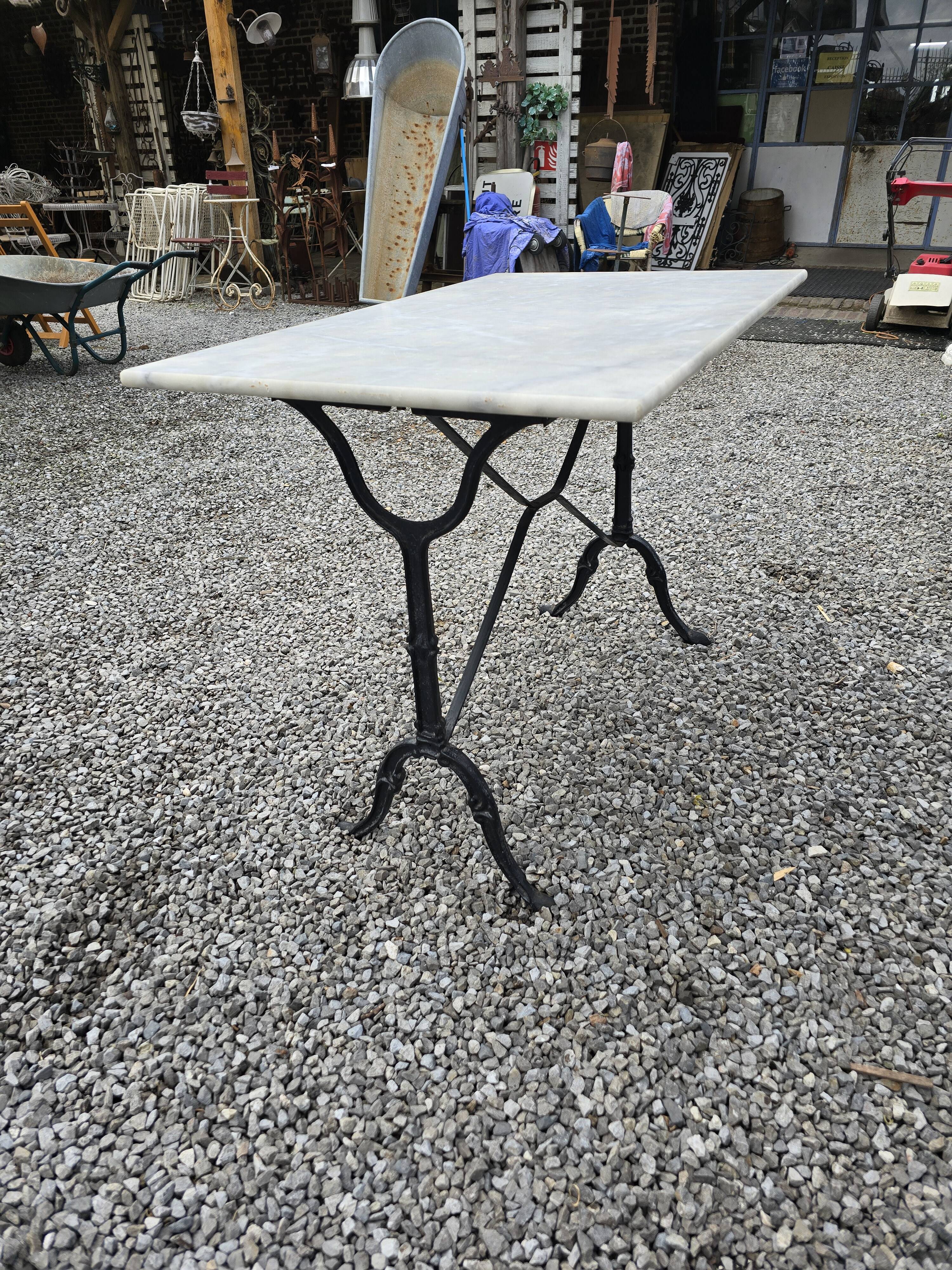 Bistro table with marble top and cast iron base