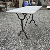 Bistro table with marble top and cast iron base