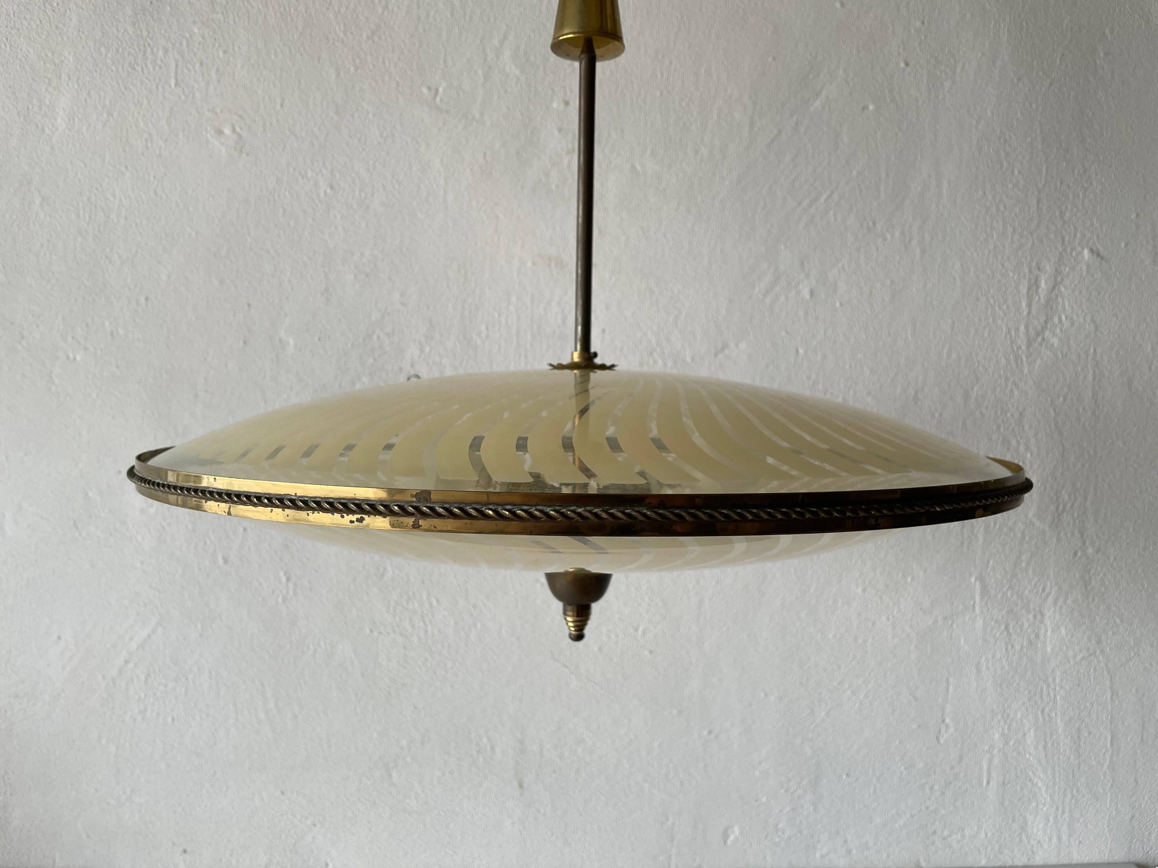 Large UFO design ceiling light in brass and printed glass, 1950s, Italy.