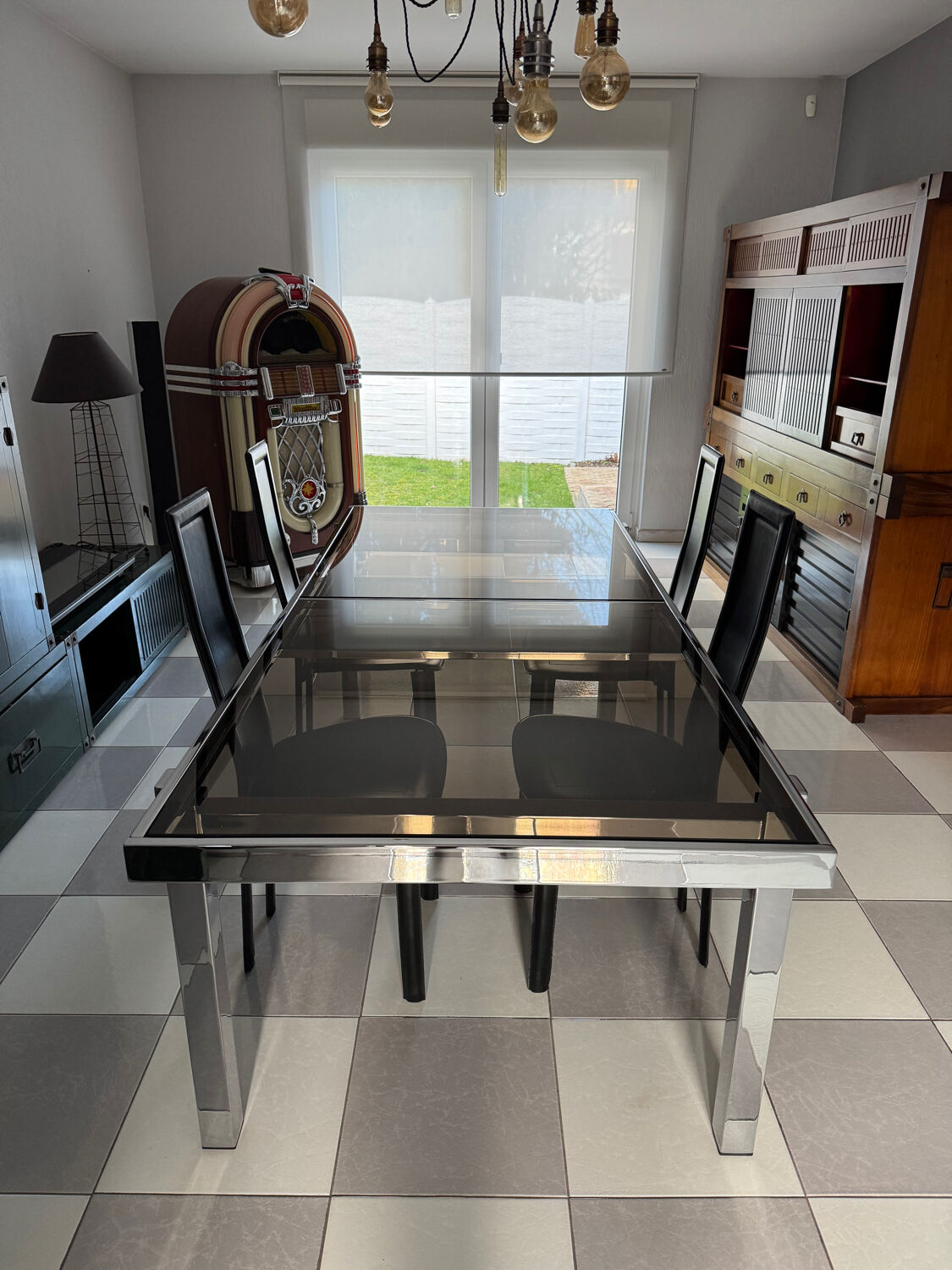 Vintage Roche Bobois dining table with smoked glass and 4 leather chairs.