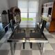 Vintage Roche Bobois dining table with smoked glass and 4 leather chairs.
