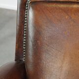 Vintage sheepskin armchair with beautiful warm colors and excellent seating comfort