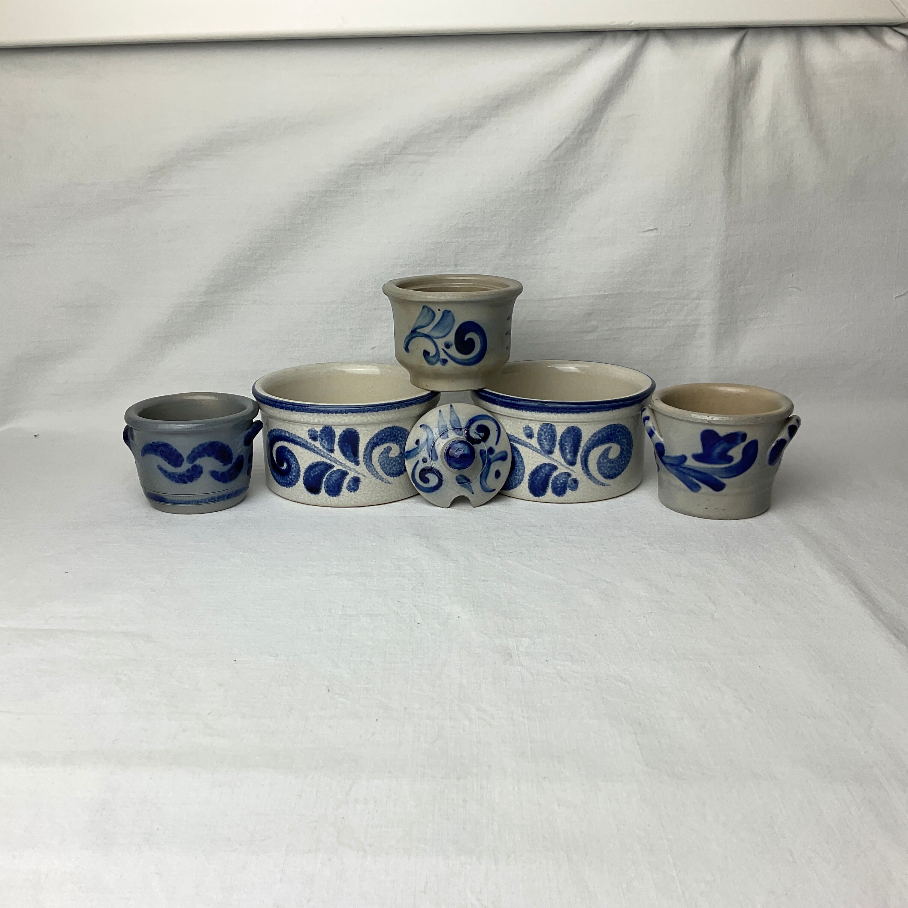 Series of 5 small blue sandstone pots