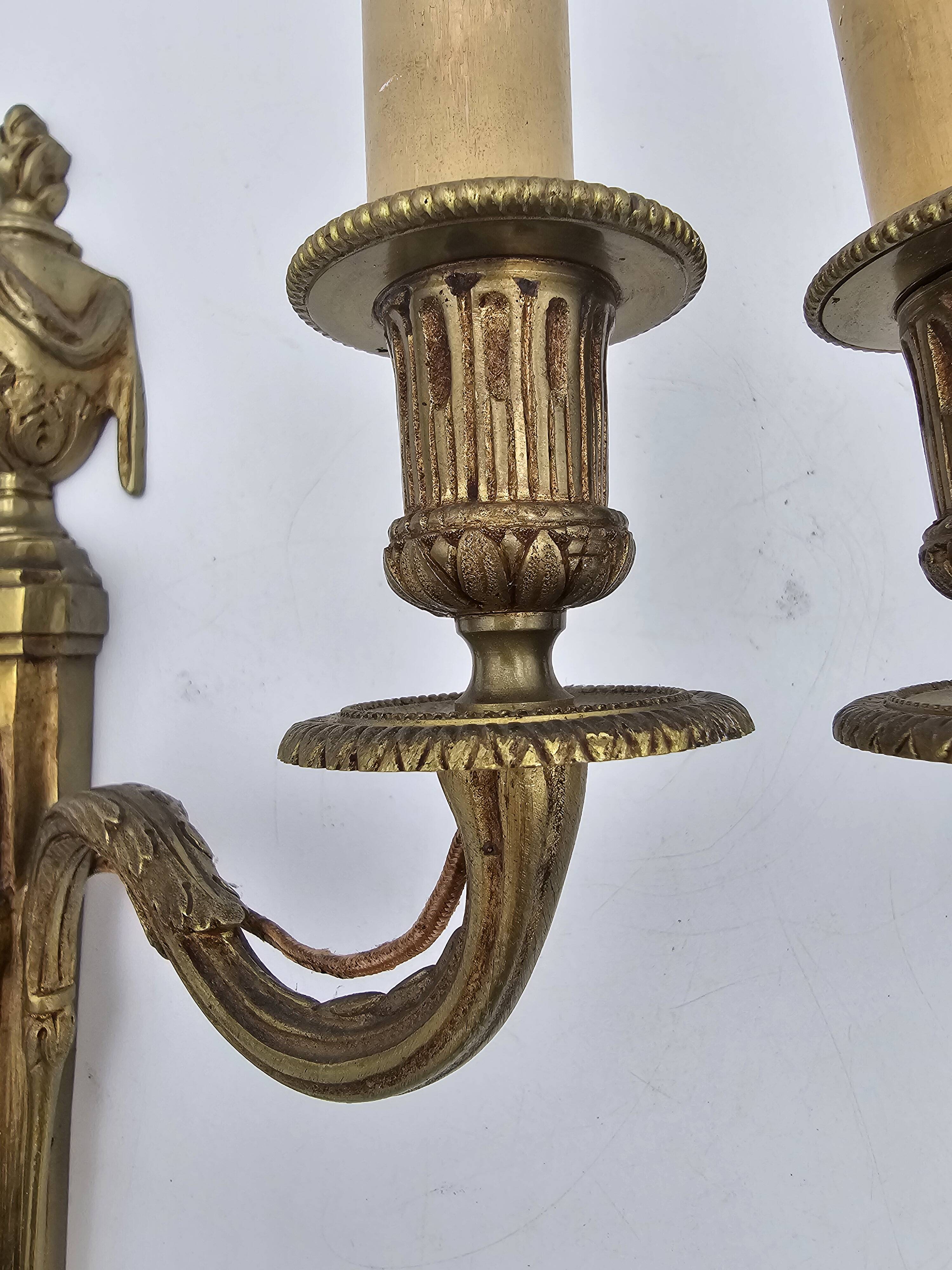 Pair of antique Louis XVI style bronze wall lights