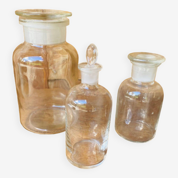 Trio of transparent glass apothecary jars