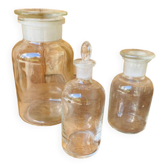 Trio of transparent glass apothecary jars