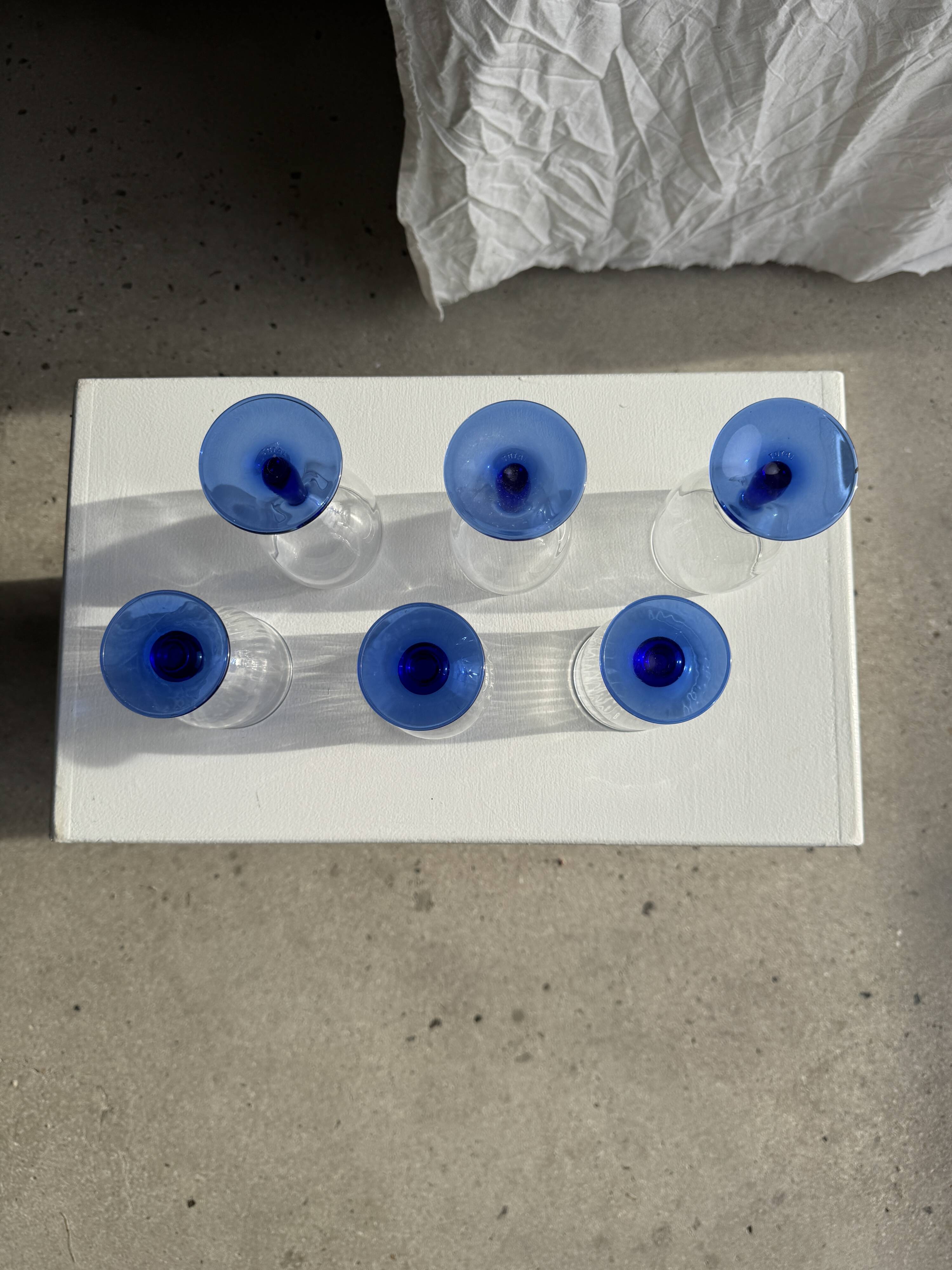 Set of 3 large blue stemmed glasses and 3 small blue stemmed glasses