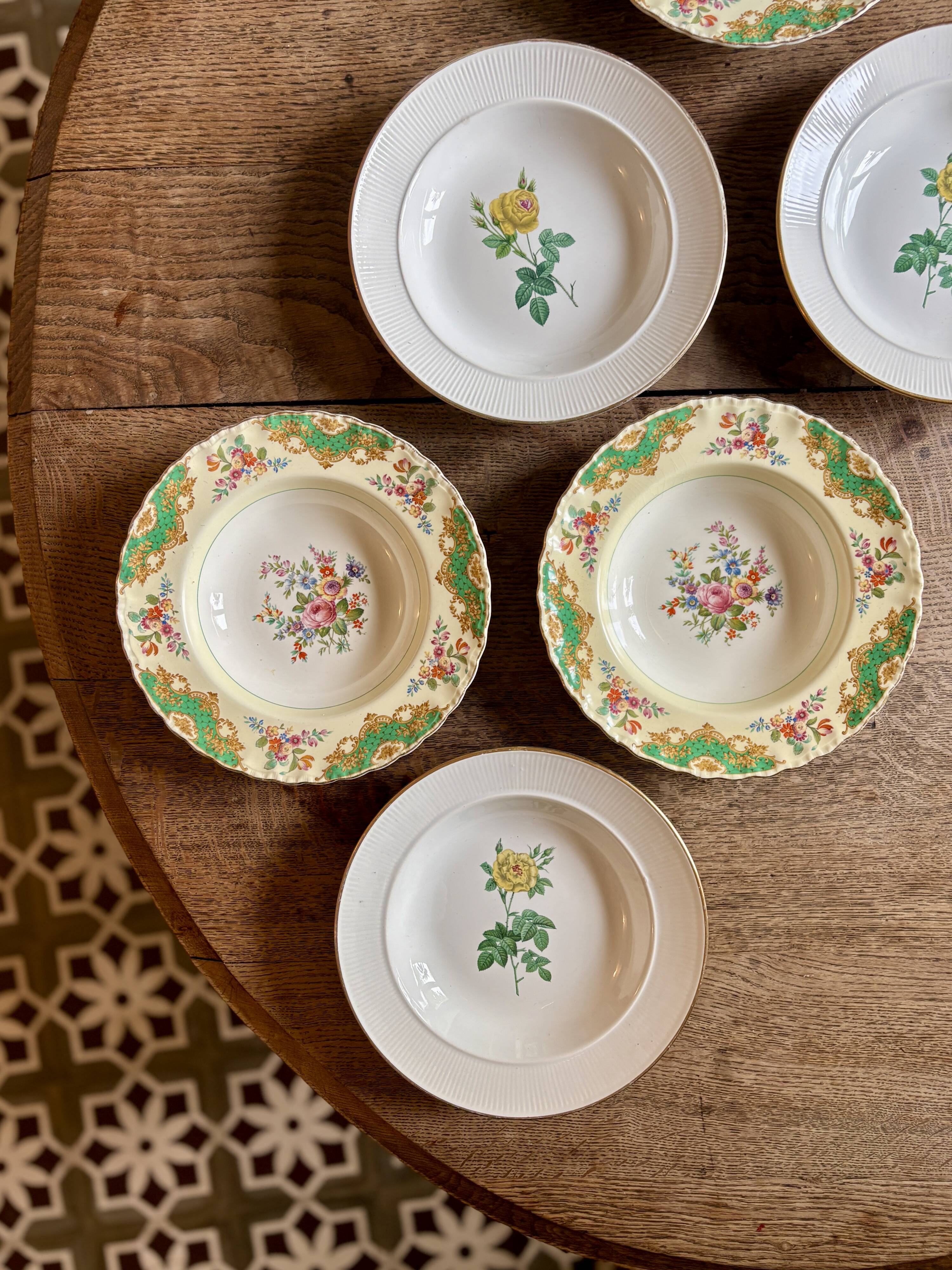 Set of 6 mismatched antique deep plates.