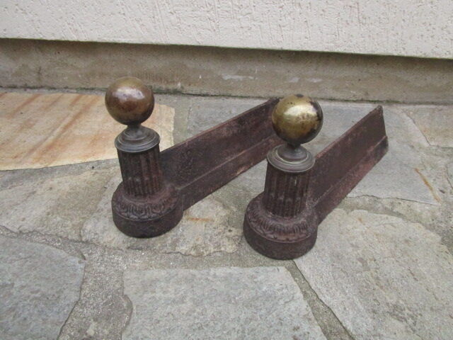 Pair of old cast iron chenets and brass ball