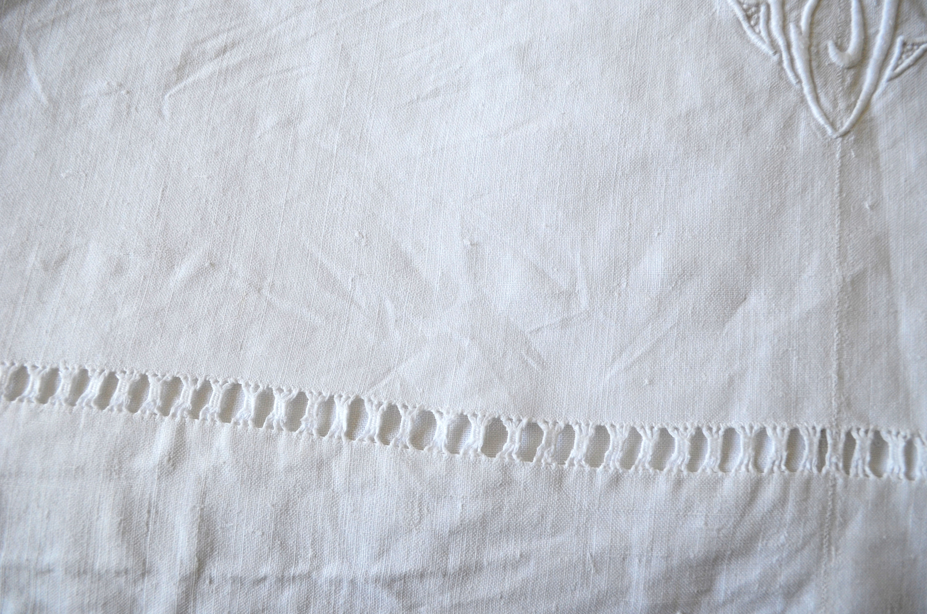 White sheet in monogrammed linen