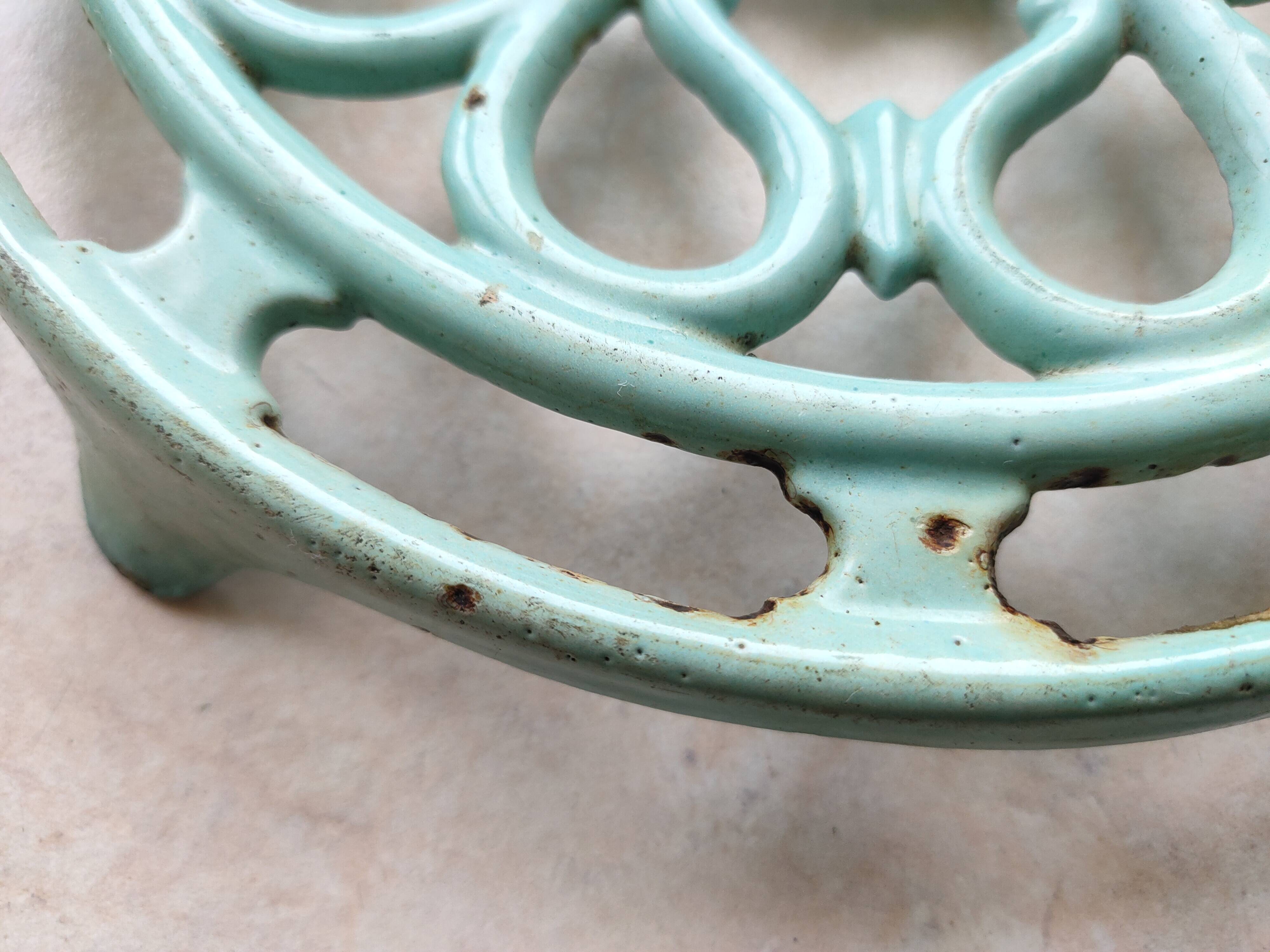 Water green enamelled trivet.