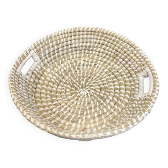Basket with woven plant fiber handles