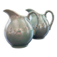 Pair of iridescent blue pitchers