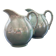 Pair of iridescent blue pitchers