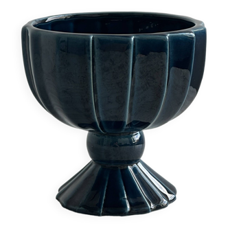 Blue glazed earthenware cup on foot.
