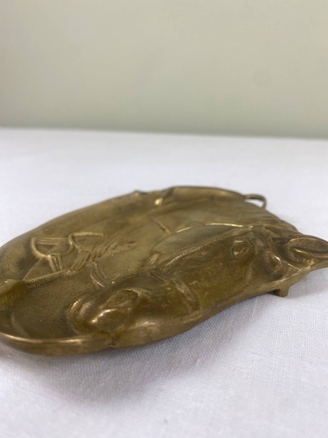 Antique brass pocket emptier