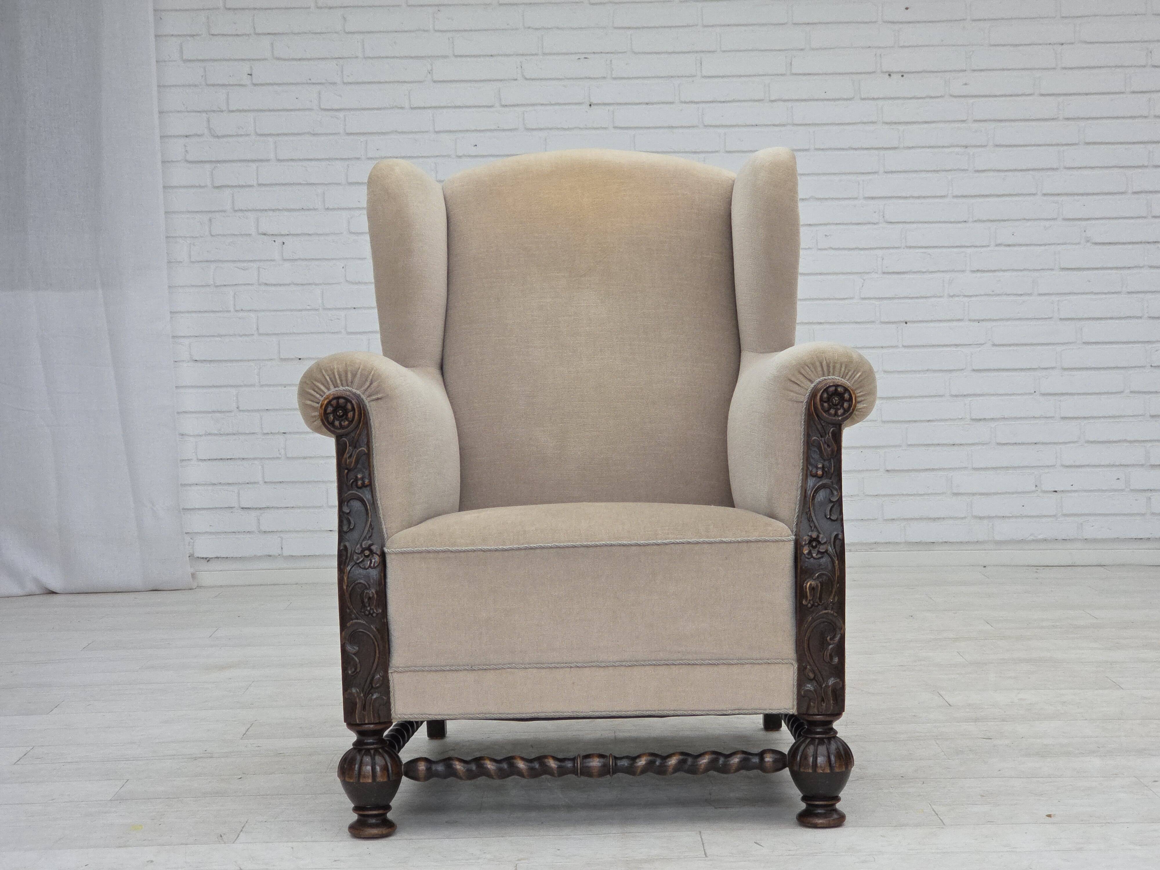 1960s, Danish wingback armchair, furniture velour, carved oak wood.