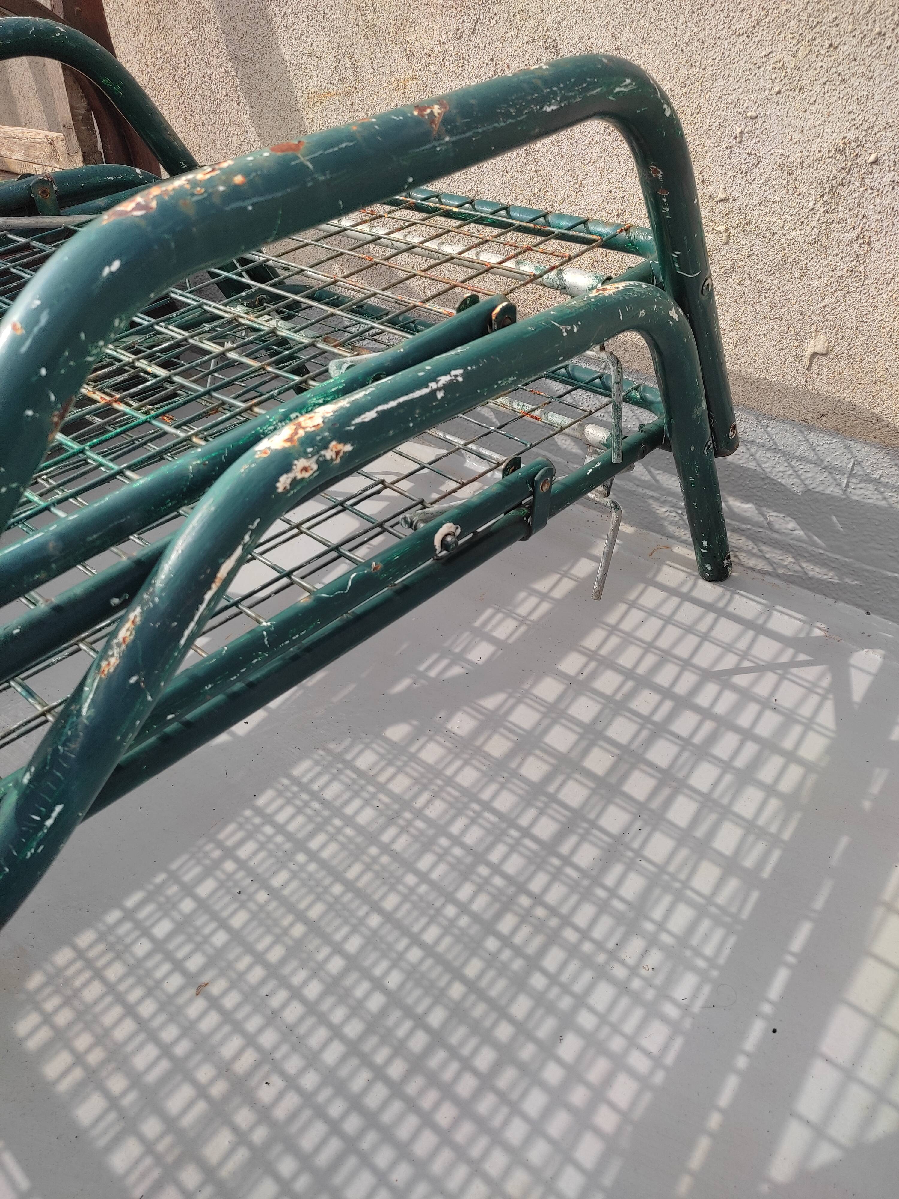 Pair of metal deckchairs