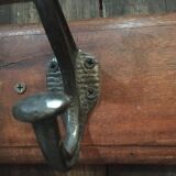 Metal patère on wood