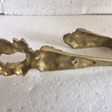 Former bronze patère