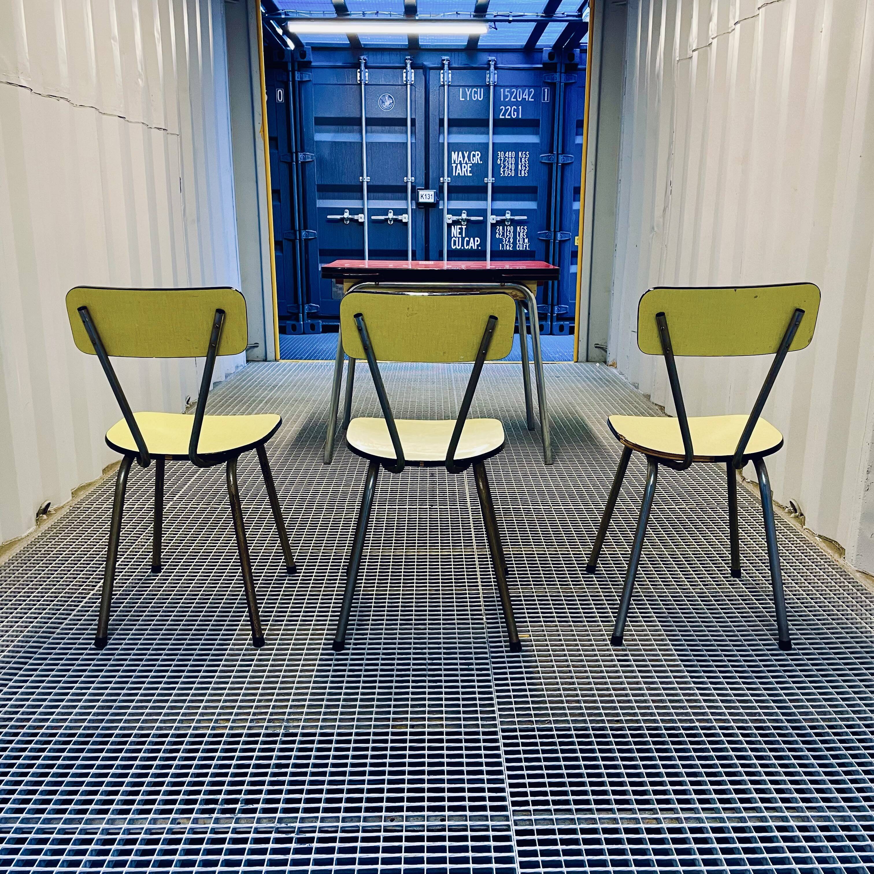 Red Formica table and vintage yellow chairs