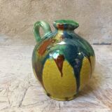 Yellow pitcher with green drips