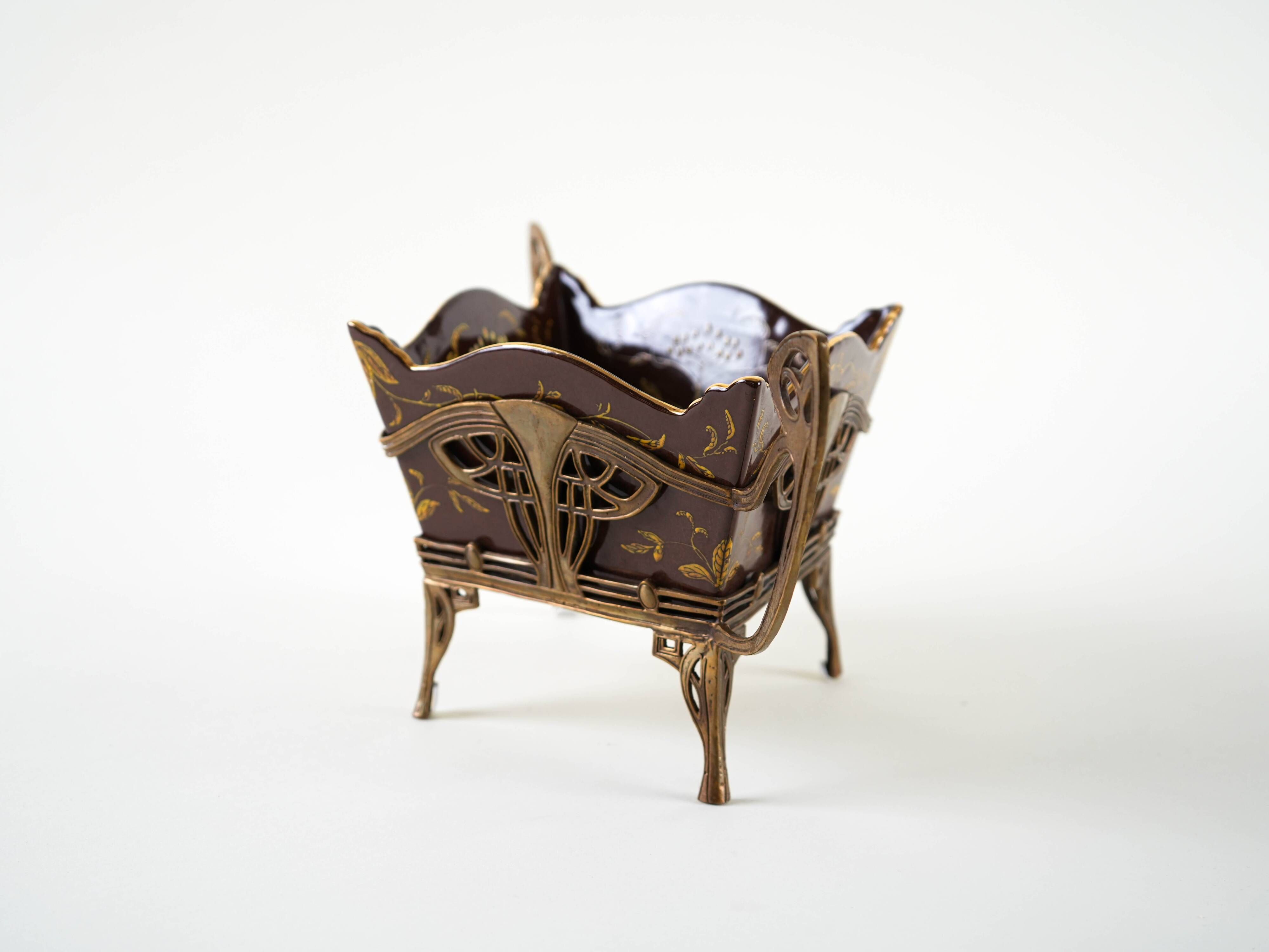 Art Nouveau platter with ceramic insert in openwork metal basket, burgundy glaze with gilt accents