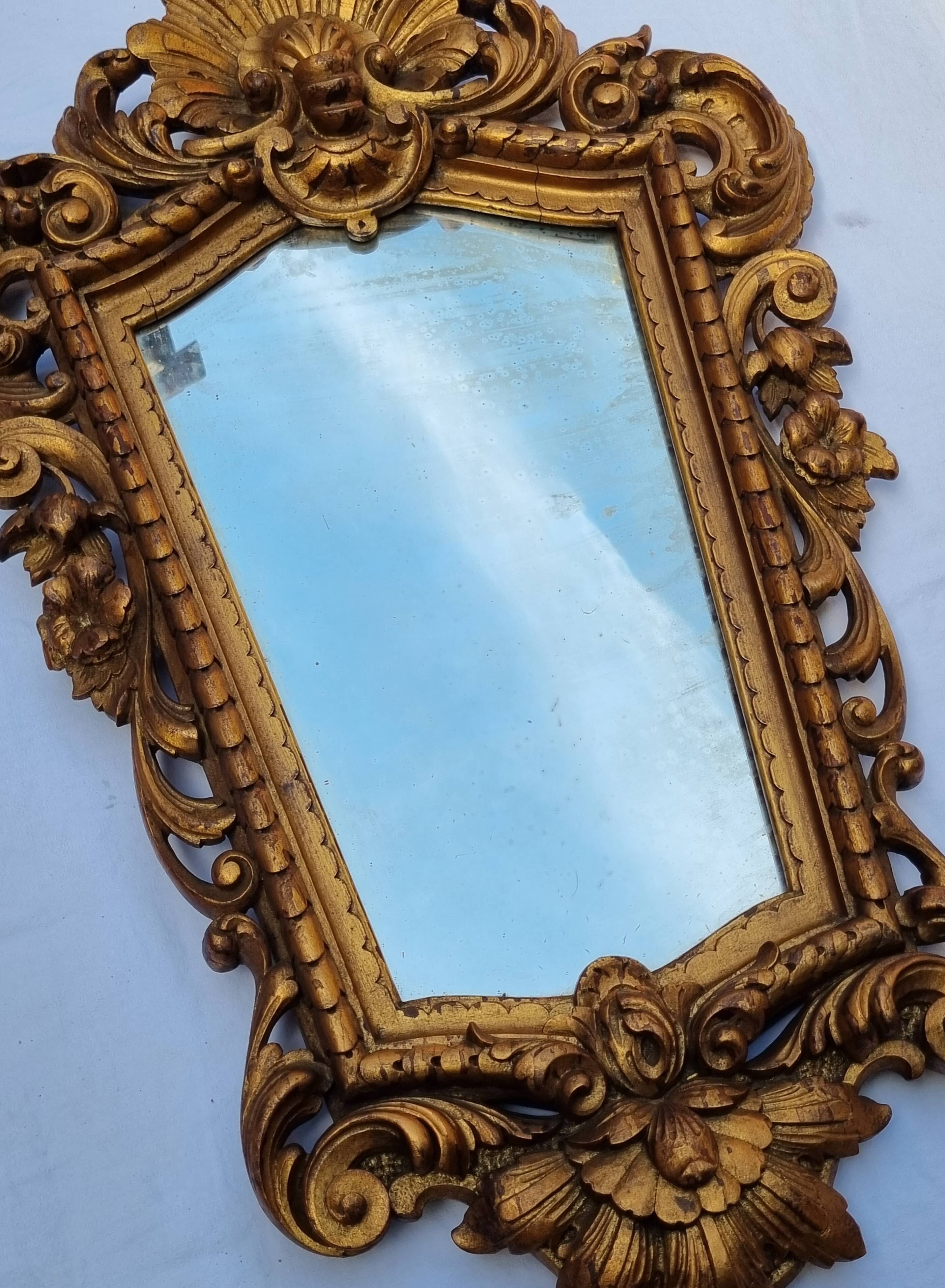 Antique wall mirror in carved gilded wood, Louis XV style, 19th century, 98 x 57 cm.