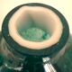 White multi-layer blown glass bottle vase with blue and green inclusions