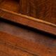 Antique English oak secretary with drop-down front.