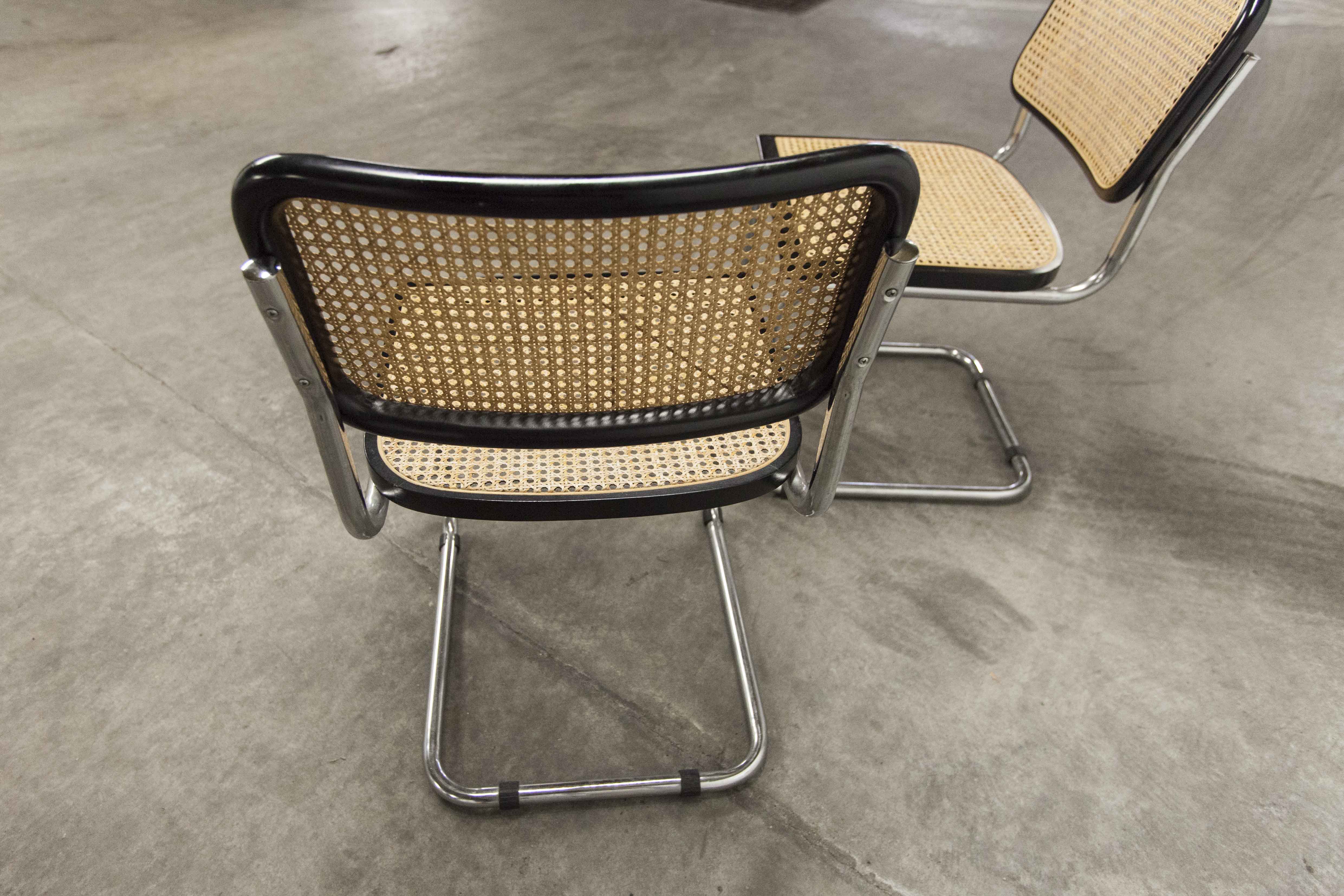 Pair of black Breuer b32 chairs and cannage