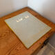 Vintage 1960s green and brown glazed ceramic mirror.