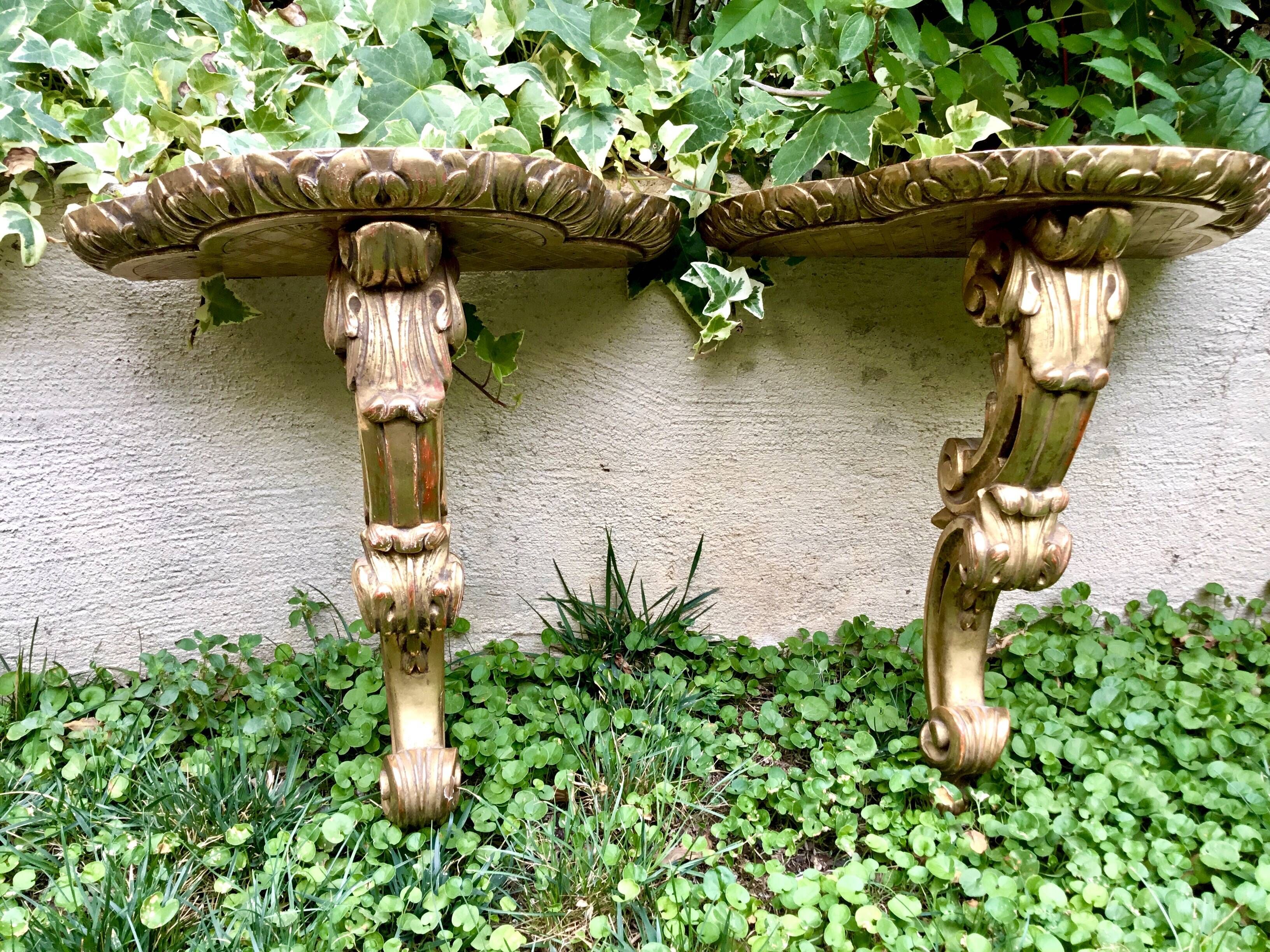 Important, pair of wooden consoles with gilded stucco in Louis XV style. XIX century.